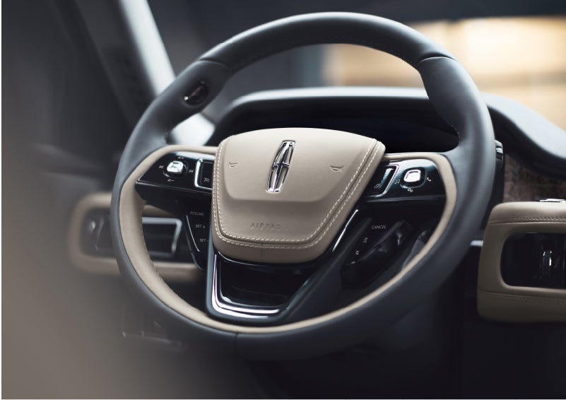 The intuitively placed controls of the steering wheel on a 2023 Lincoln Aviator® SUV | George Ballentine Lincoln in Greenwood SC