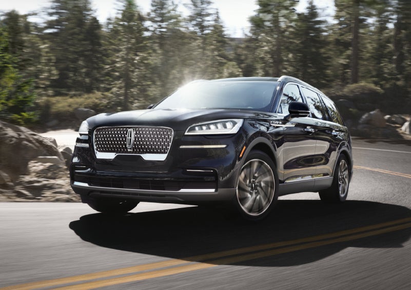 A Lincoln Aviator® SUV is being driven on a winding mountain road | George Ballentine Lincoln in Greenwood SC