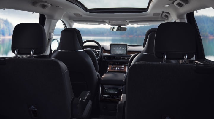 The interior of a 2024 Lincoln Aviator® SUV from behind the second row | George Ballentine Lincoln in Greenwood SC