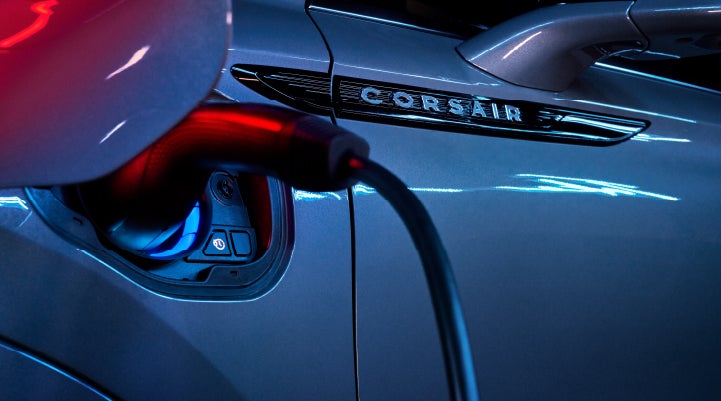 A charger plugged into the charging port of a 2024 Lincoln Corsair® Plug-in Hybrid model. | George Ballentine Lincoln in Greenwood SC